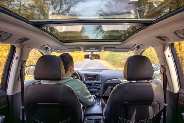 driving-modern-car-asphalt-road-young-man-drives-car_169016-64409