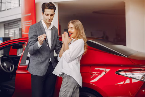 elegant-couple-car-salon_1157-20474