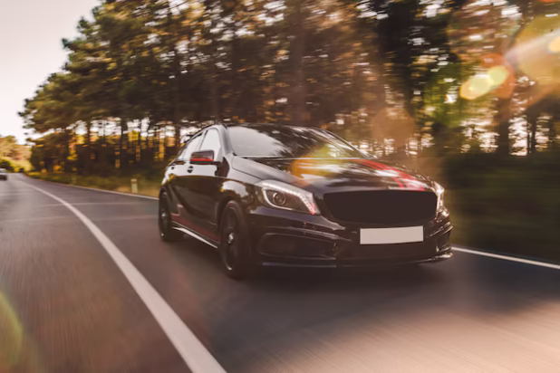 front-view-black-luxury-sedan-road_114579-5030
