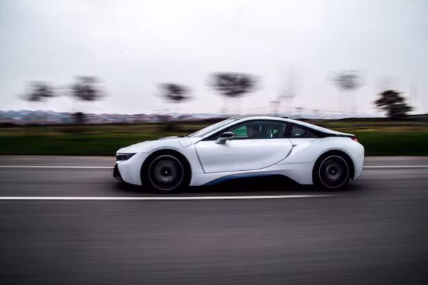 high-speed-test-driving-white-sport-car_114579-4051
