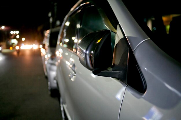 close-up-illuminated-car-street-night_1048944-27982594