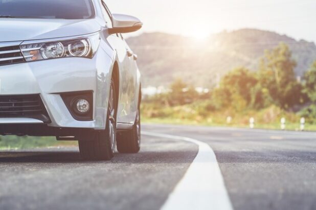 front-new-silver-car-parking-asphalt-road-thailand_30478-246