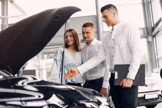 stylish-elegant-couple-car-salon_1157-24865