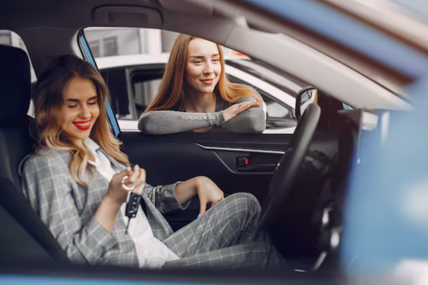 two-stylish-women-car-salon_1157-20665