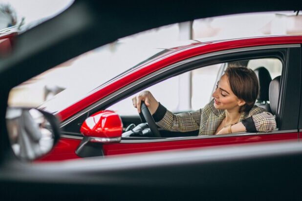 woman-sitting-i-car-car-showrrom_1303-14095